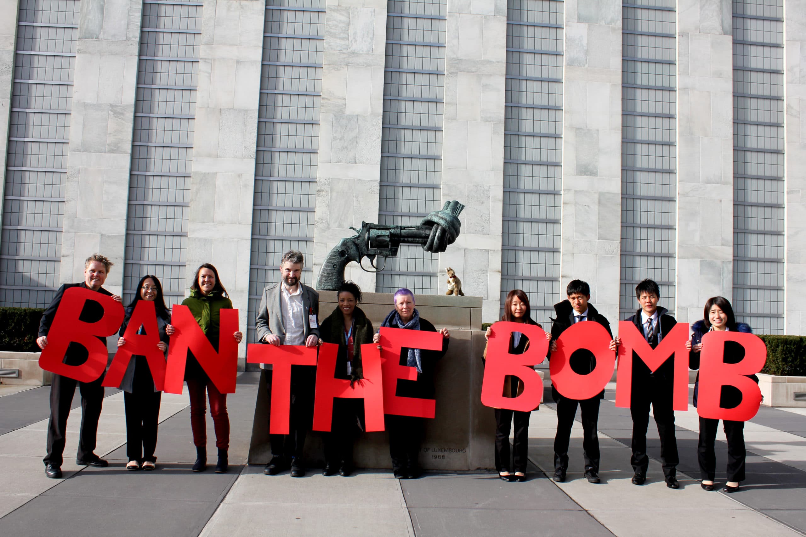 ICAN members holding Ban the Bomb sign at the United Nations